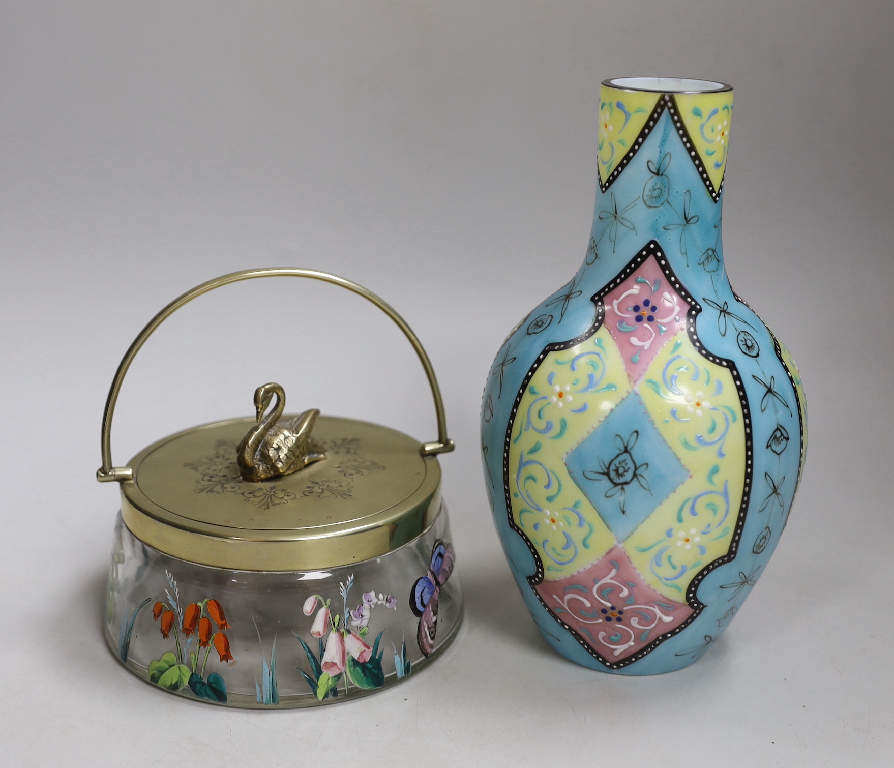 A Bohemian enamelled glass jar with silver plated cover, possibly Moser, together with a French enamelled glass vase. Tallest 20cm